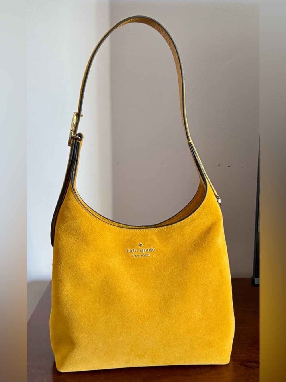 Kate Spade 454 Suede Small Shoulder Bag in the color Squash Blossom.